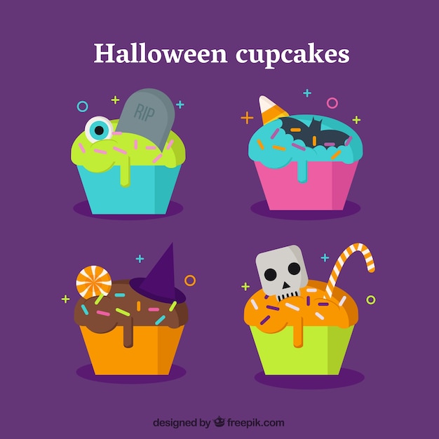 Free vector four delicious cupcakes for halloween