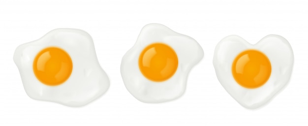 Fried eggs in heart shape top view