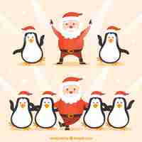 Free vector funny santa claus and penguins dancing