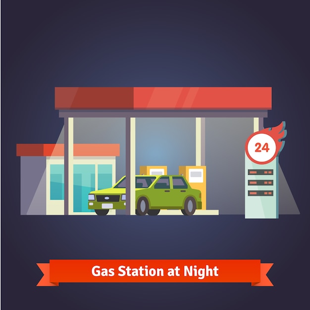 Gas station glowing at night. store, price board