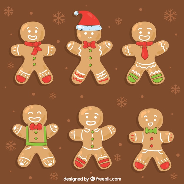 Free vector gingerbread man cookies on a brown background