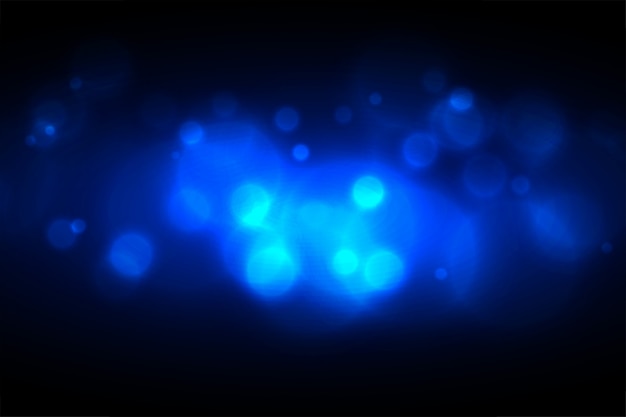 Vettore gratuito incandescente design effetto luce blu bokeh