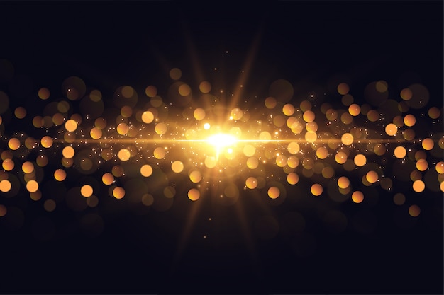 Glowing lights flare sparkles golden bokeh background