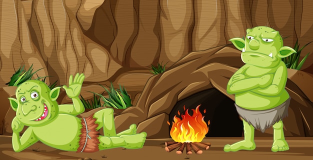 Free vector goblins or trolls with cave house and camp fire in cartoon style