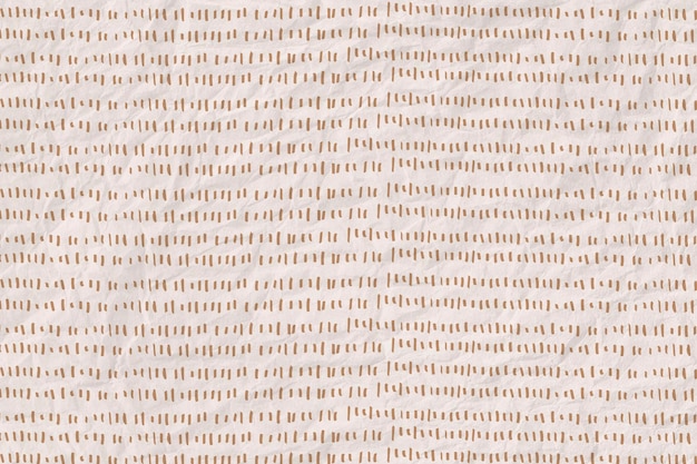 Gold dashed line pattern on crumpled paper textured background