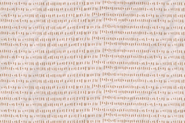 Gold dashed line pattern on crumpled paper textured background