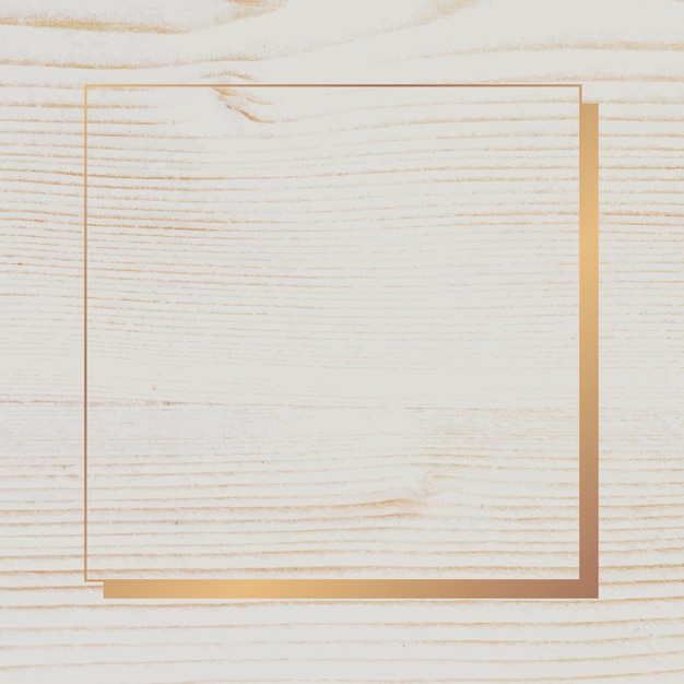 Золотая рамка на бежевом деревянном фоне