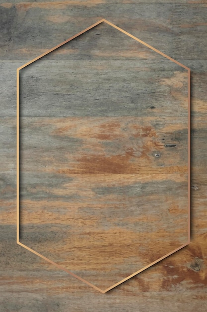 Free vector gold frame on grunge wooden background vector