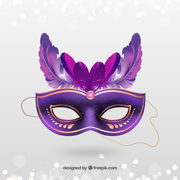 Golden carnival mask with pink feathers