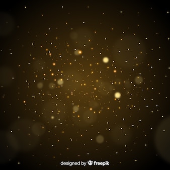 Golden particles blurred decorative background