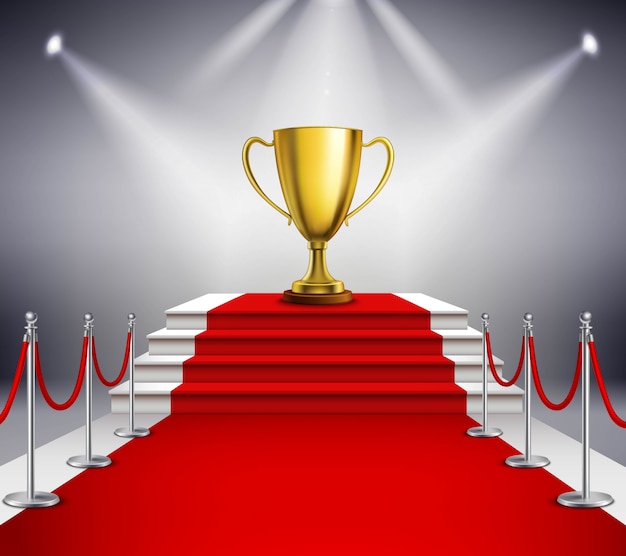 Golden trophy on white stairs covered with red carpet and illuminated by spotlight