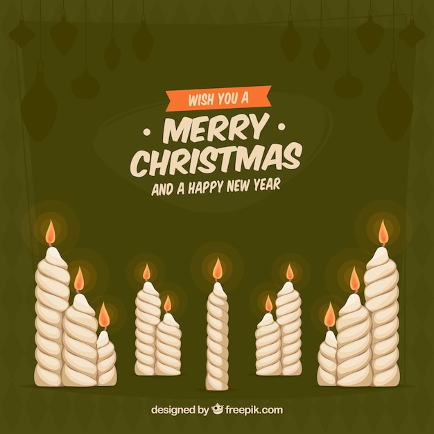 Free vector green background with christmas candles