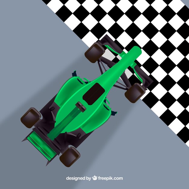 Green formula 1 racing car crossing finish line