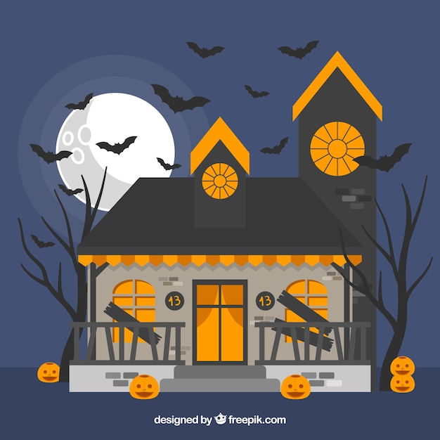 Halloween background with haunted house and bats