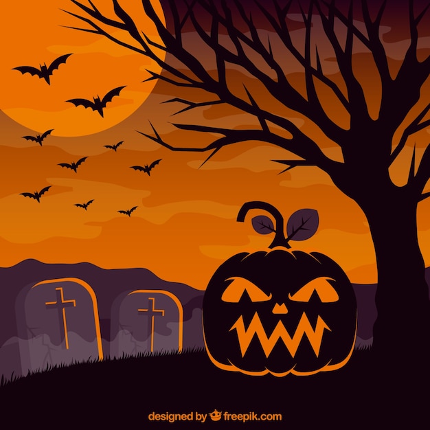 Halloween background with pumpkin in the cemetery