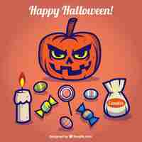 Free vector halloween card with a pumpkin and candies