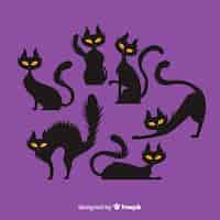 Vettore gratuito collezione di gatti di halloween con design piatto