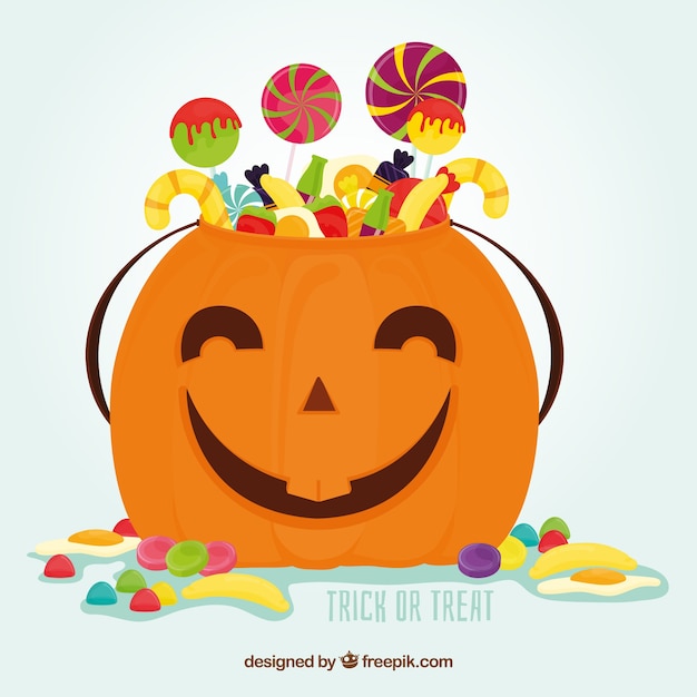 Free vector halloween pumpkin with candies and lollipops