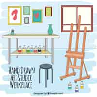 Free vector hand drawn artistic workplace