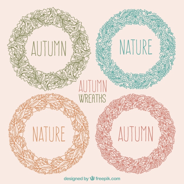 Free vector hand-drawn autumn ornamental wreaths