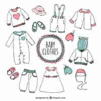 Free vector hand drawn baby clothes