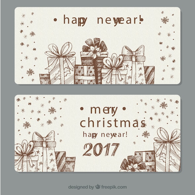 Free vector hand-drawn banners with decorative gifts for new year