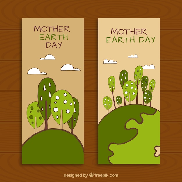 Hand-drawn banners with decorative trees for mother earth day