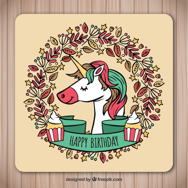 Hand drawn birthday card with unicorn and leaves