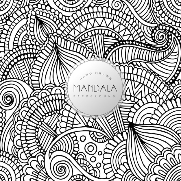 黒と白の花の曼荼羅パターンの背景を描いた手