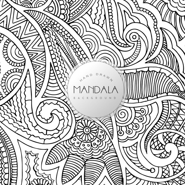 黒と白の花の曼荼羅パターンの背景を描いた手