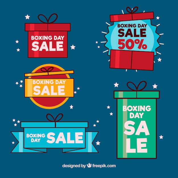 Free vector hand drawn boxing day sale badge in gift boxes shape