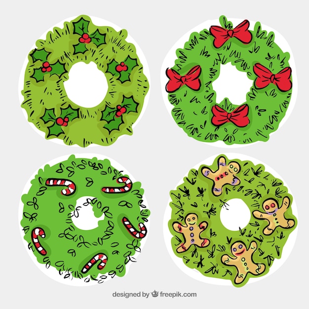 Free vector hand drawn christmas wreaths