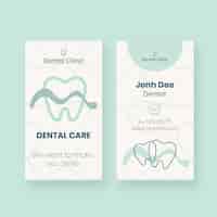 Free vector hand drawn dental clinic vertical business card