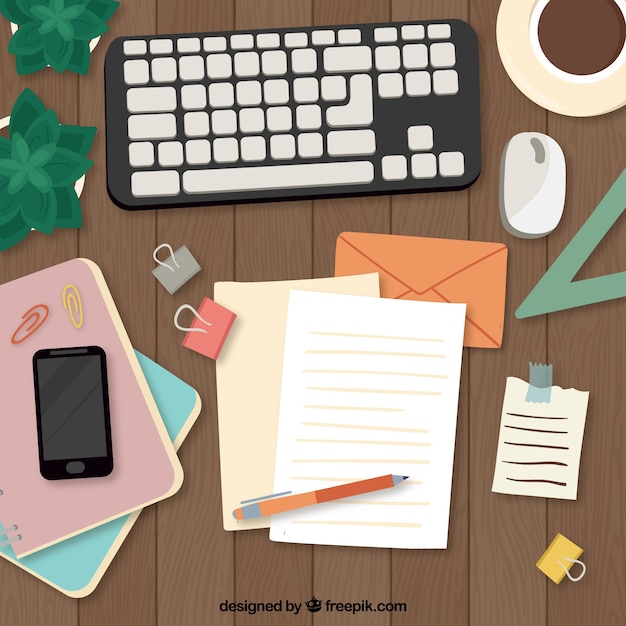 Free vector hand drawn desk with keyboard and documents