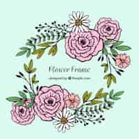 Free vector hand drawn floral frame with roses and daisies