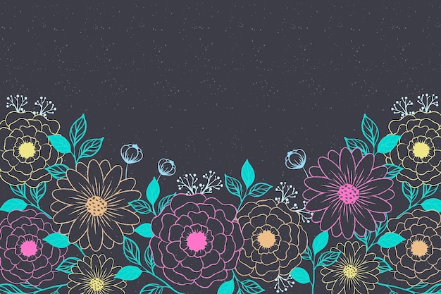 Free vector hand drawn flowers on blackboard background