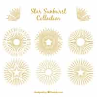 Free vector hand drawn golden star and sunburst decoration