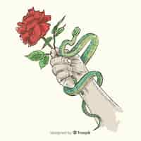 Free vector hand drawn hand holding rose and snake background