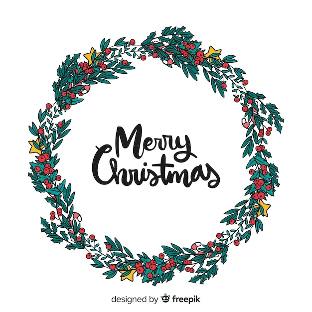 Free vector hand drawn leaves and berries christmas wreath