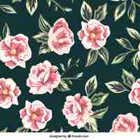 Free vector hand-drawn pattern of flowers in pink tones