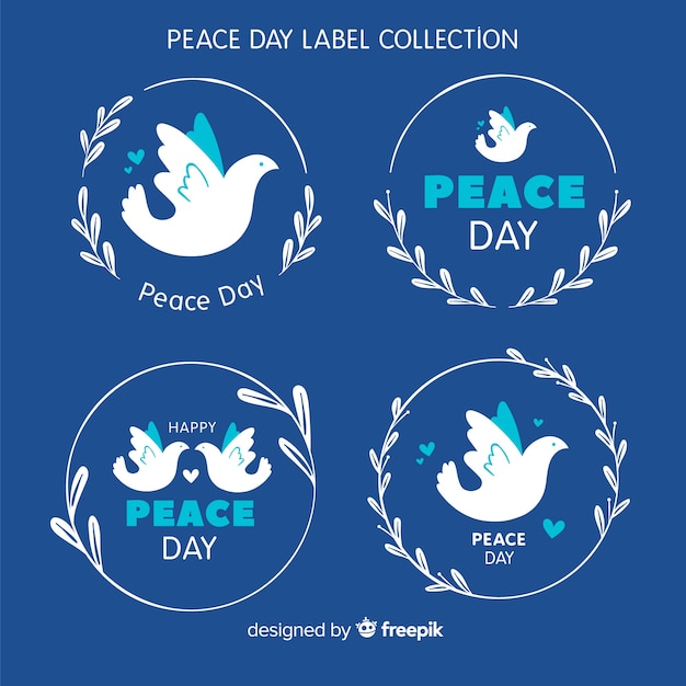 Free vector hand drawn peace day dove label collection