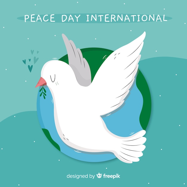 Hand drawn peace day dove with world