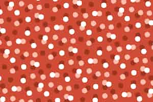 Free vector hand drawn red polka dot background