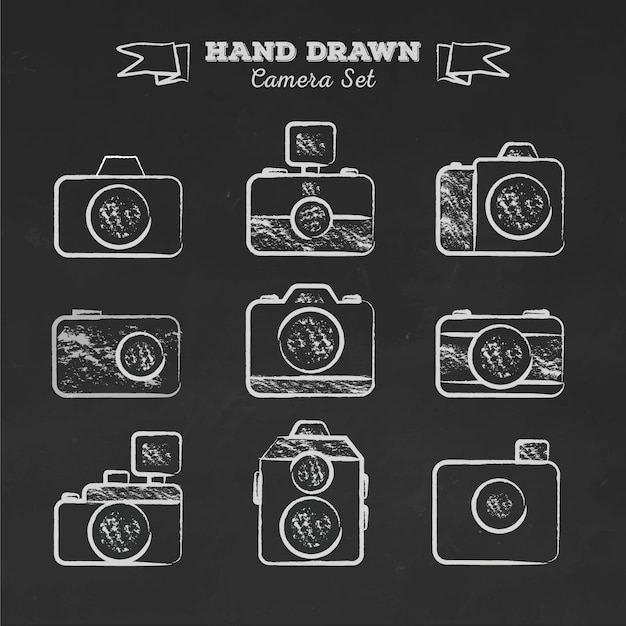 Free vector hand drawn retro cameras on blackboard