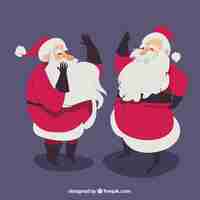 Free vector hand drawn santa claus in different postures