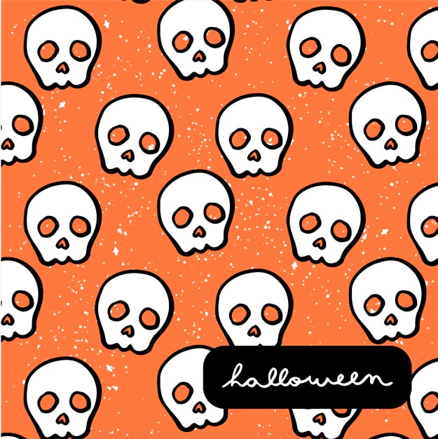 Free vector hand drawn skulls pattern