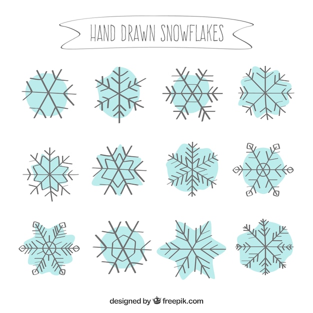 Vettore gratuito hand drawn snowflakes collection