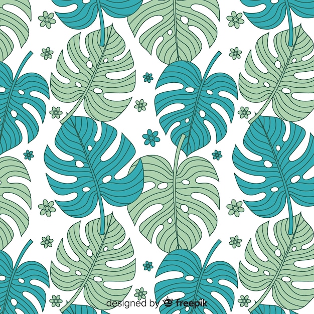 Free vector hand drawn tropical leaves background