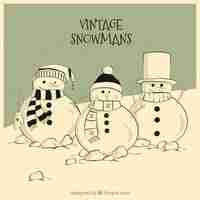 Free vector hand drawn vintage snowmen card