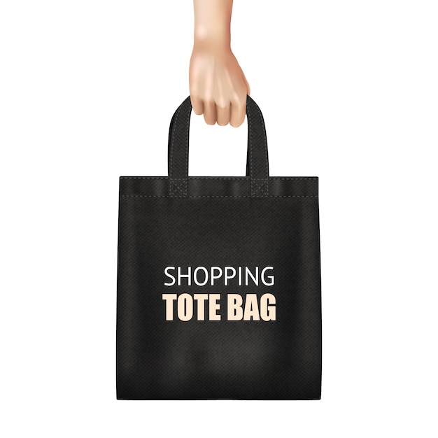 Hand holding fashionable black canvas shopping tote bag